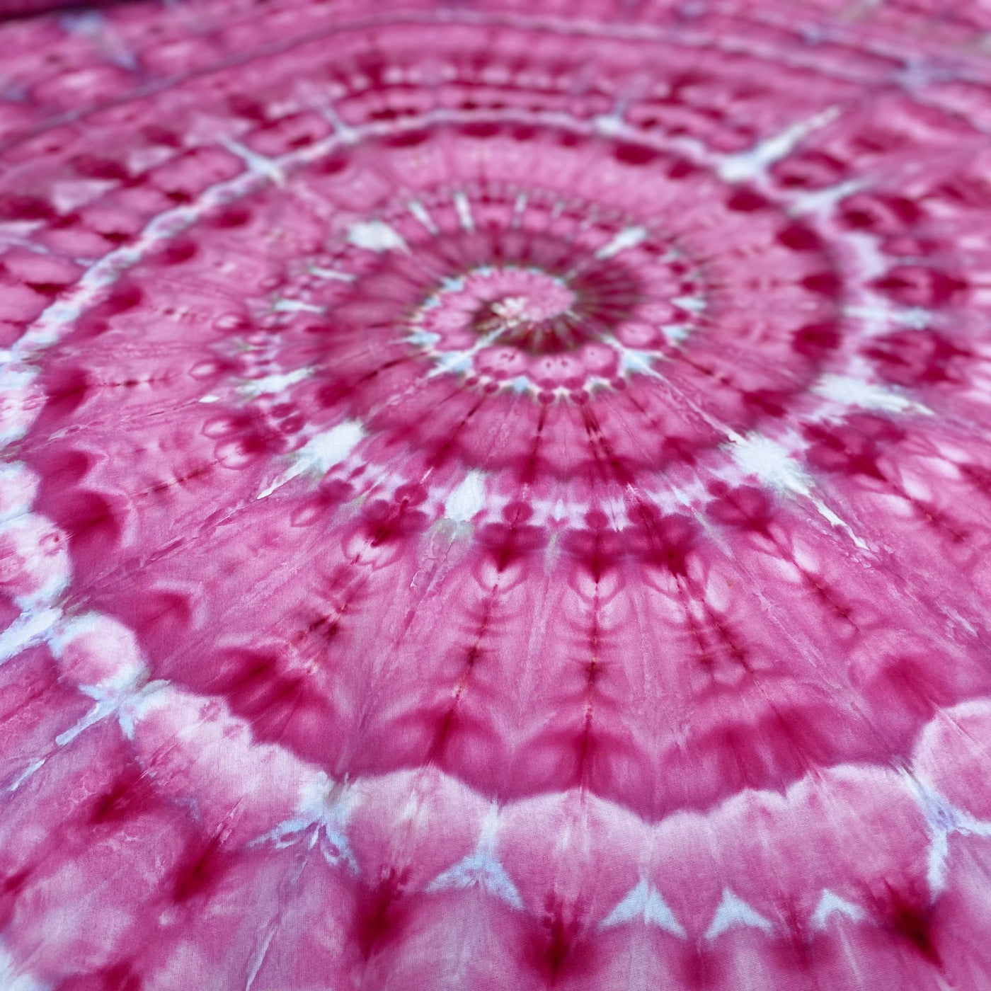 Close-up of a pink and white tie-dye pattern