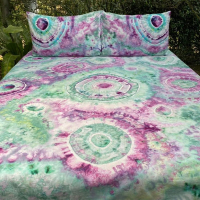 green and purple tie dye bedding with circles